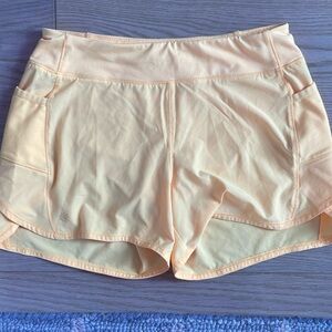 Bright yellow Athleta girl shorts